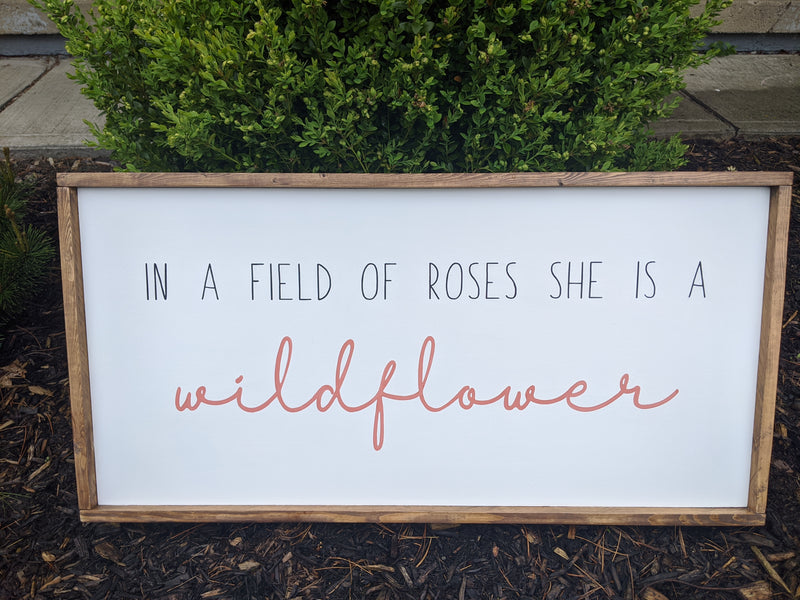 In a Field of Roses, She is a Wildflower – West Clay